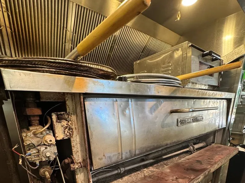 Bakers Pride deck pizza oven with the control panel open during the repair